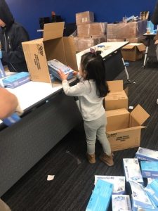 picture of kids helping pack boxes